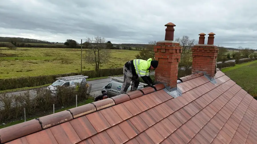 Lead tray and flashing detail between twin chimney stacks