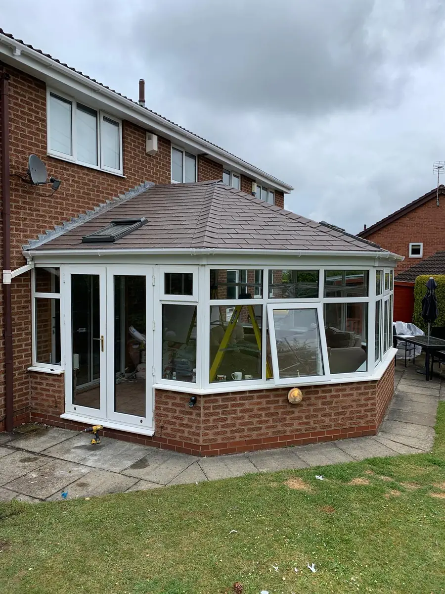 Conservatory fitted with a lightweight tiled replacement roof