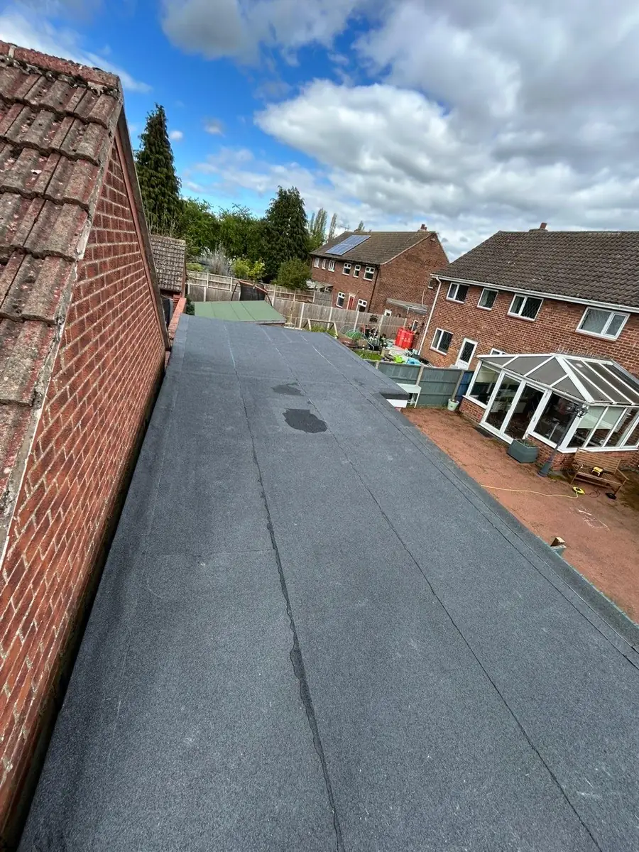 Rear extension flat roof finished and weathered in