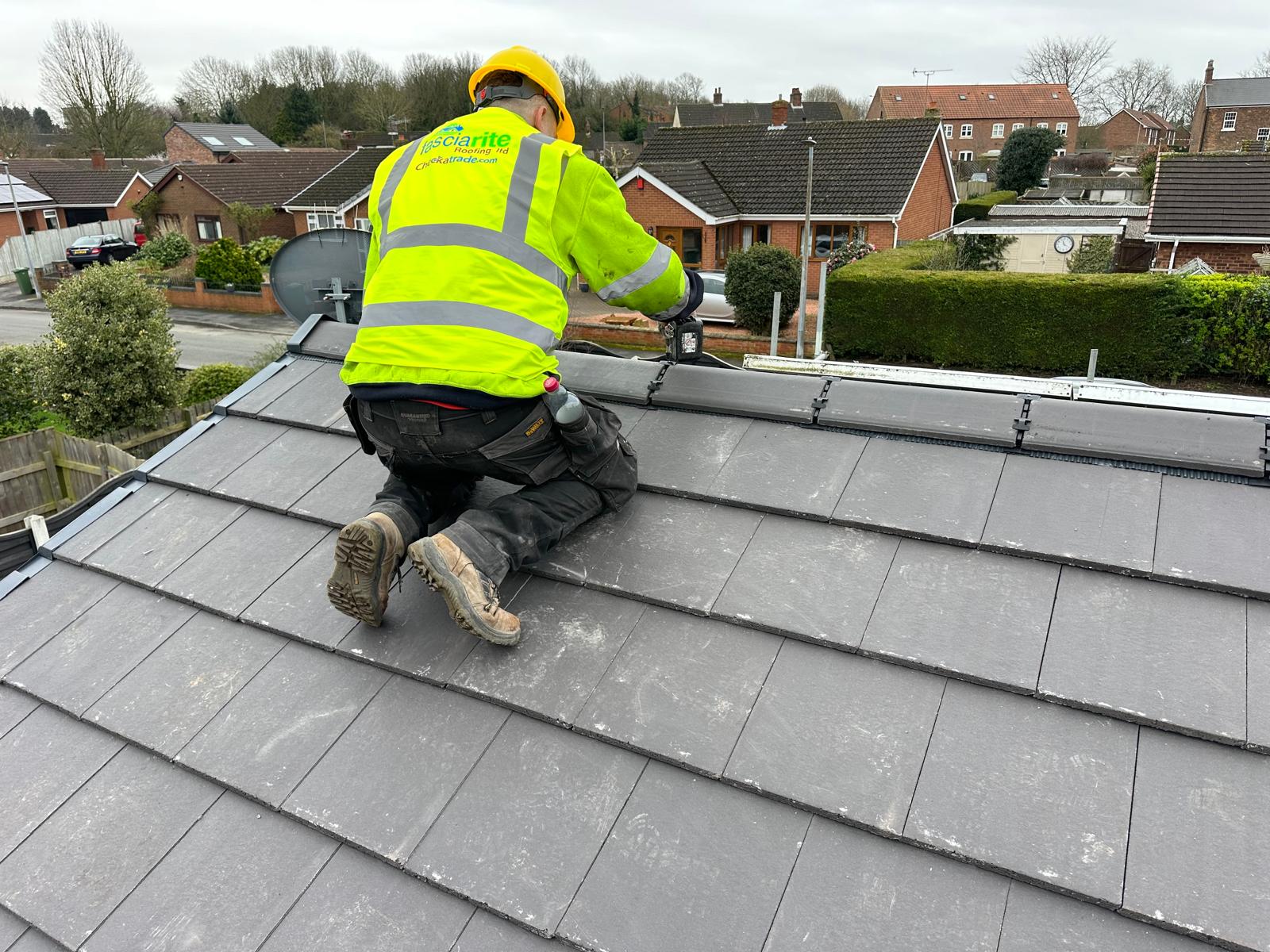 A RoofRite roofer at work